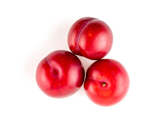 Overhead shot of tasty small red plums
