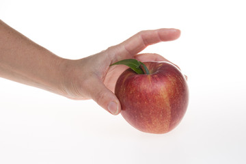 Girl hands holding a red apple over white