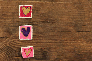 Valentine's Day with hearts on wooden background
