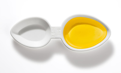 Small plastic drug dosing spoon isolated with clipping path