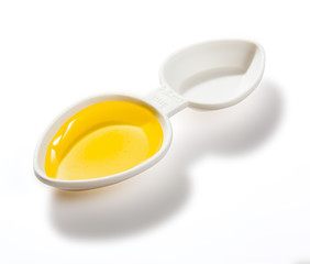 Small plastic drug dosing spoon isolated with clipping path