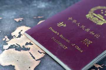 Image of travel, with Chinese passport and map