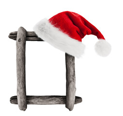 Christmas hat hung on frame of dry branches