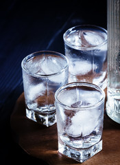 Cold vodka in a sweaty glass, toned image, selective focus