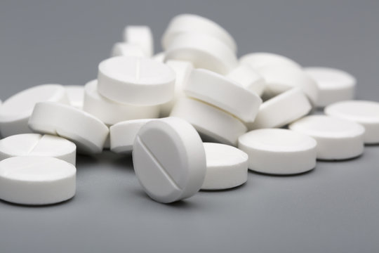 Heap of white round pills medical