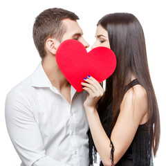 Young beautiful couple with present isolated on white