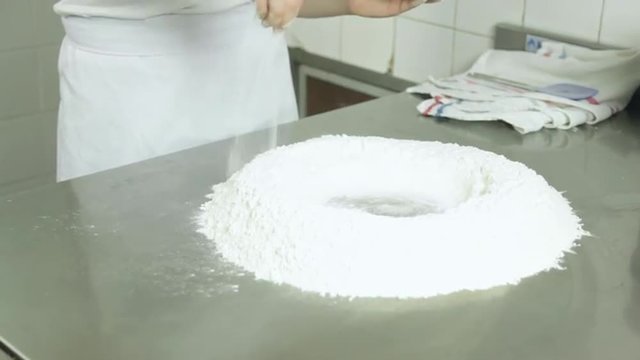 Woman preparing  pizza dought