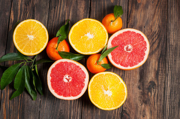 Citrus fruits. Oranges, grapefruits and mandarins. Over wooden table background. Top view