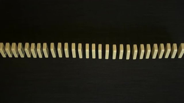 Side view of a large domino effect in slow motion 96 fps