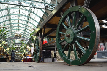 Green wheels of an old cart at Covent Garden, London
