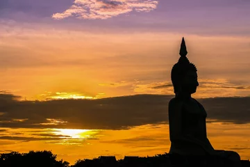 Poster Boeddha The shadow of seated buddha in evening sunset