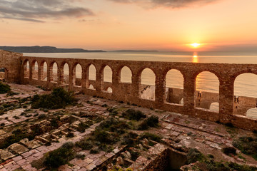 Ruins of Industrial Mining / Ruins of industrial mining along the west coast of Sardinia. Panorama at sunset. The Marmora washery.