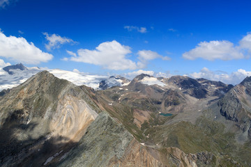 Fototapeta na wymiar Panorama view with lake Eissee, mountain Weißspitze and glacier Großvenediger in the Hohe Tauern Alps, Austria