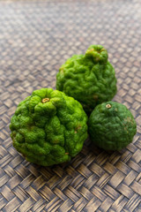 bergamot fruit on Thai woven stripes background, closeup