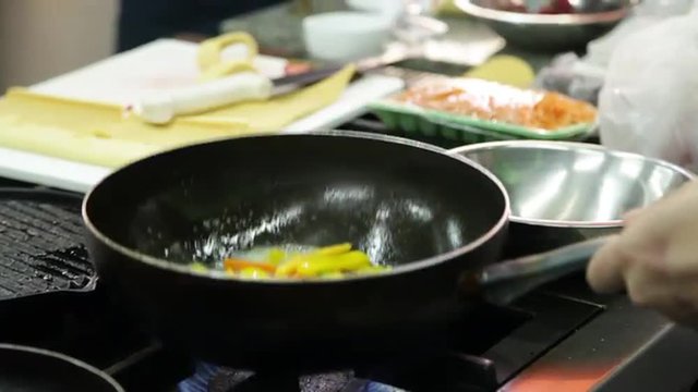 Saute vegetables in an iron pan