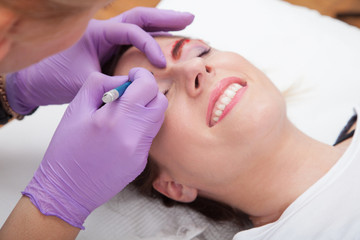Obraz na płótnie Canvas Cosmetologists' preparations for permanent eyebrow make up