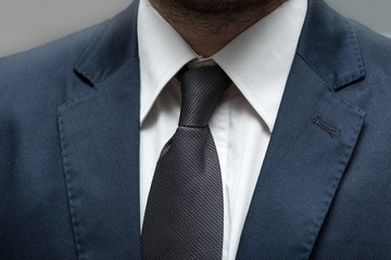 businessman in a suit with a tie and white shirt with close