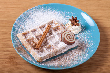 Traditional belgium soft fresh waffles with a decor on a plate
