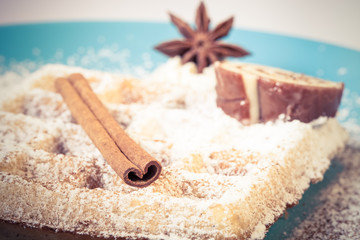 Traditional belgium soft fresh waffles with a decor on a plate.