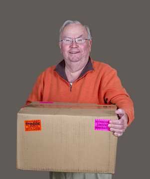 A Senior With A Brown Box