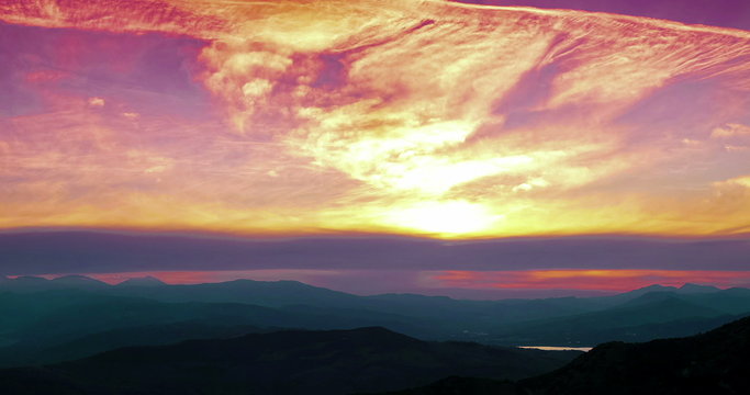 sunset scene with mountains in background time lapse, colorful sky with soft clouds 4K and HD