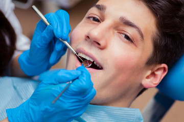 Dentist treatment a patient's teeth in the dentist.