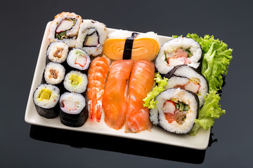 Sushi collection, isolated on black background.