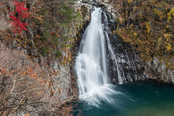 Fototapeta na wymiar beautiful waterfall in forest, autumn landscape