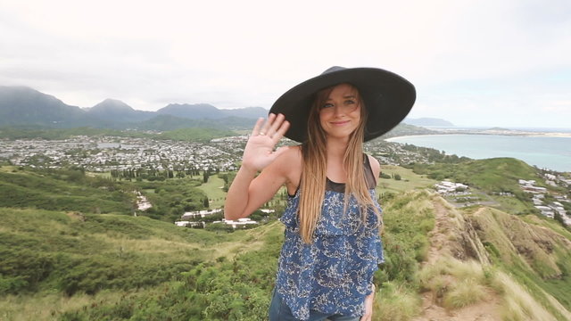 Close up portrait of beautiful young woman with hat at Pillbox Hike, Oahu Hawaii.
