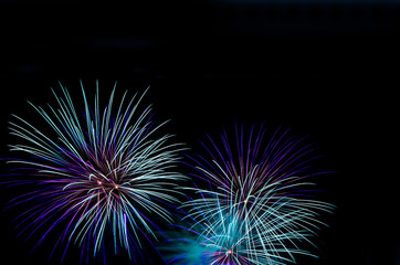 Blue fireworks with black copy space