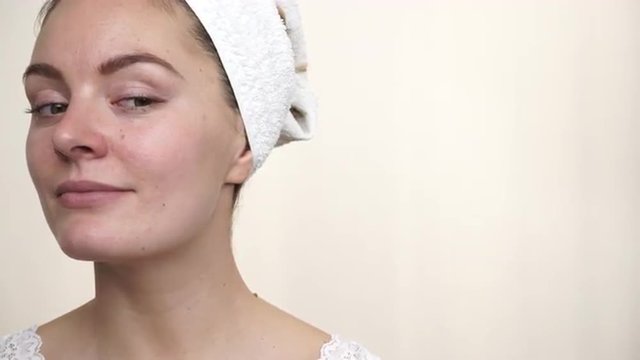 Woman in towel on head with no makeup 4K