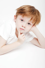 Portrait of a cute little boy on a white background