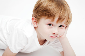 Portrait of a cute little boy on a white background