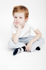 Portrait of a cute little boy on a white background