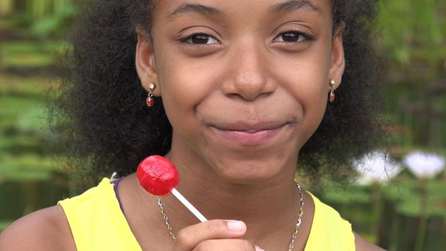Teen Girl Eating Lollipop