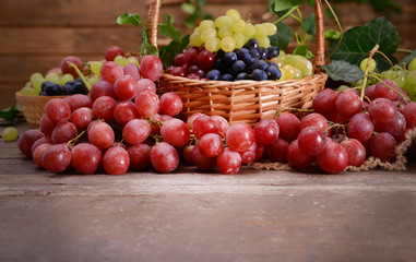 Grape in basket on wooden table