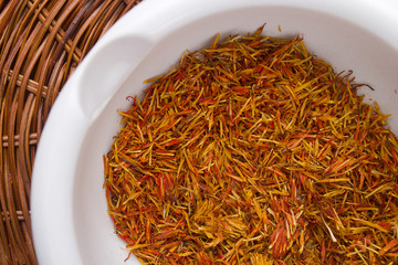 Inflorescence of saffron in a ceramic mortar