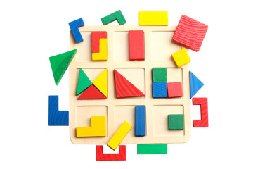 Baby sorter with geometric figures from wood on a white isolated background