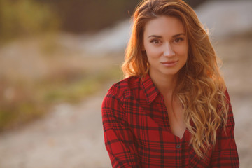 Fototapeta premium Woman portrait outdoor in sunset light.