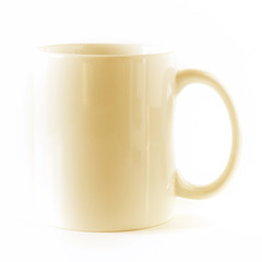 A orange mug, empty, isolated on white background.