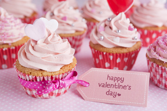Pink Valentine cupcakes with the words 'Happy Valentine's day'