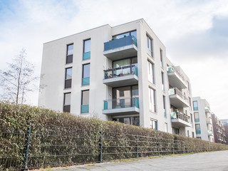 Fototapeta premium Low Rise Apartment Buildings Surrounded by Hedge