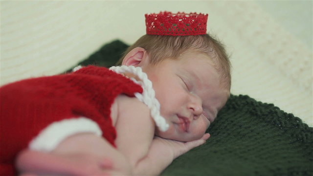 Close-up of a newborn baby girl sleeping