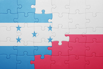 Fototapeta premium puzzle with the national flag of honduras and poland