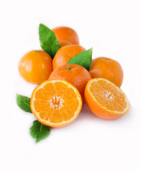 Ripe tangerines with leaves isolated on white background