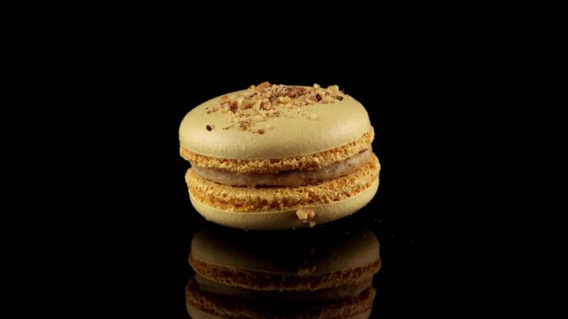 Traditional macaron with nuts (horizontal view with reflection)
