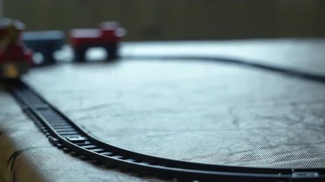 Childs toy train moving around its track can be looped