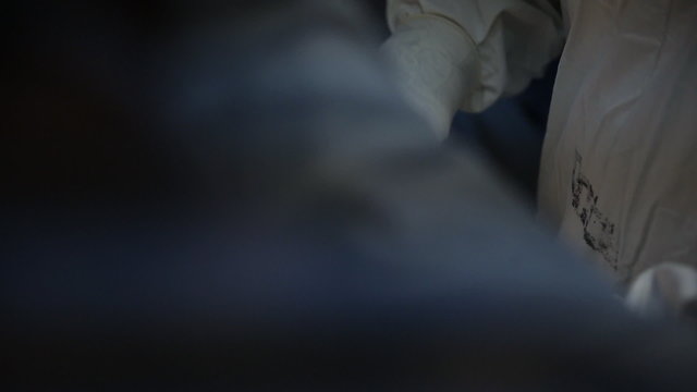 Caesarean section, surgeon cutting stomach with scalpel