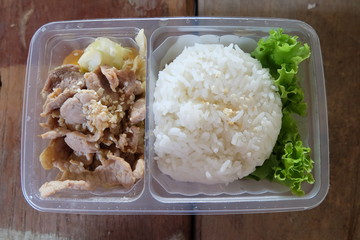 korean pork with rice in plastic box