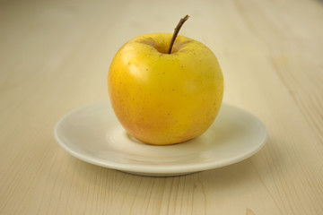 Delicious and fresh apple on  white plate